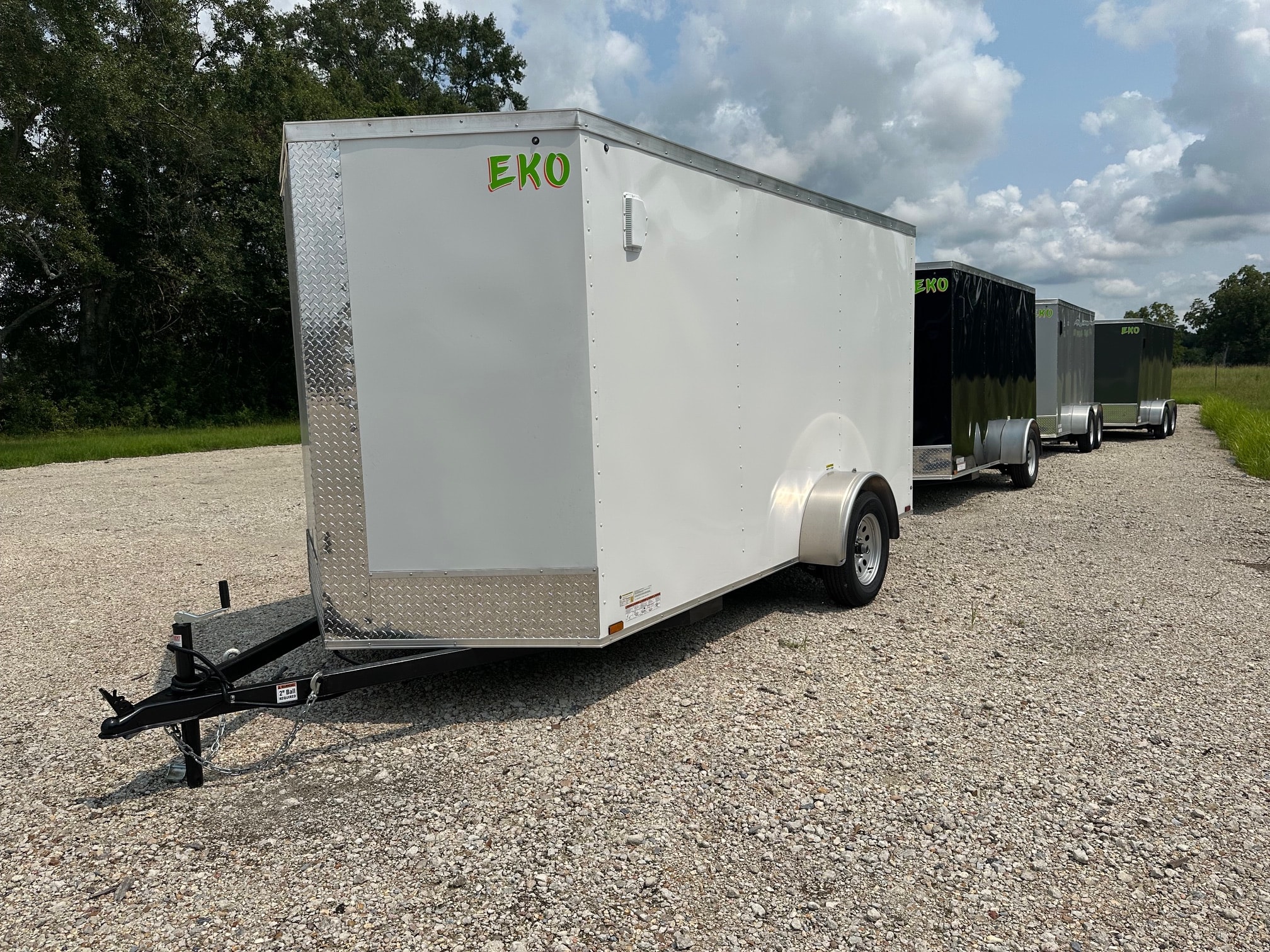 Arising enclosed cargo trailers row on lot