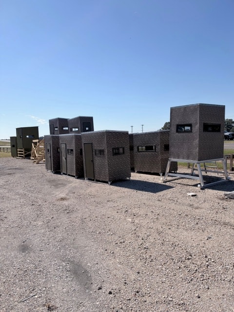 Aluminum and wood hunting stands on lot at Delta Trailer Sales Lafayette Louisiana