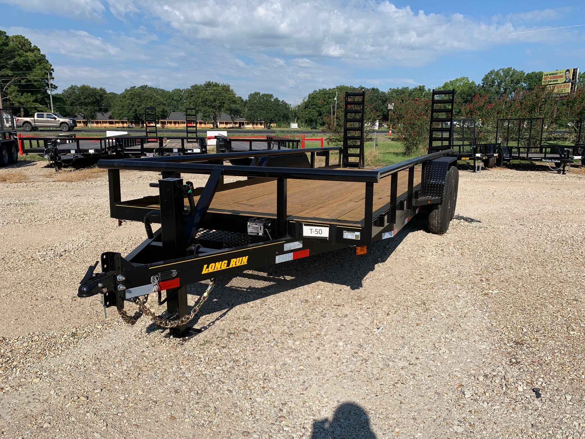Long Run HD equipment trailer T-50 with Bobcat standup ramps at Delta Trailer Sales